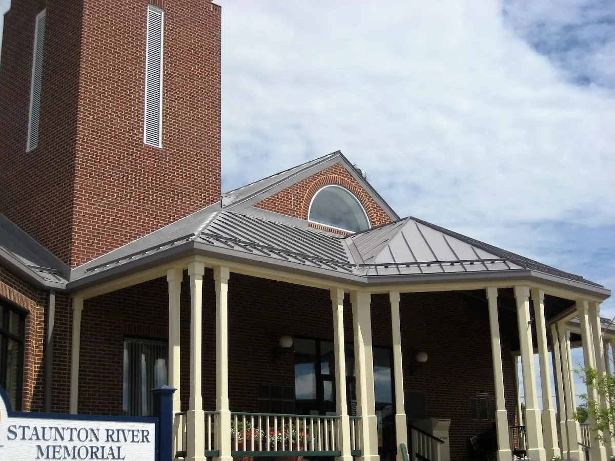 Skilled roofing craftsmen working on a residential roof in Windsor Locks